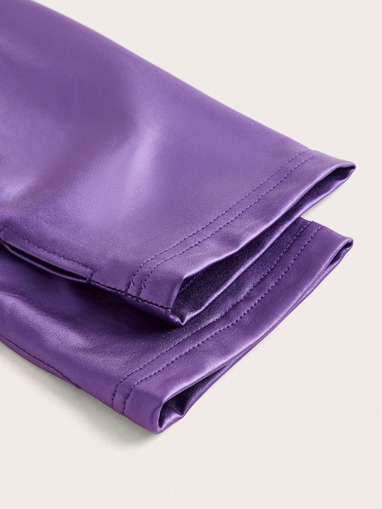 Purple metallic jacket zoom on textile