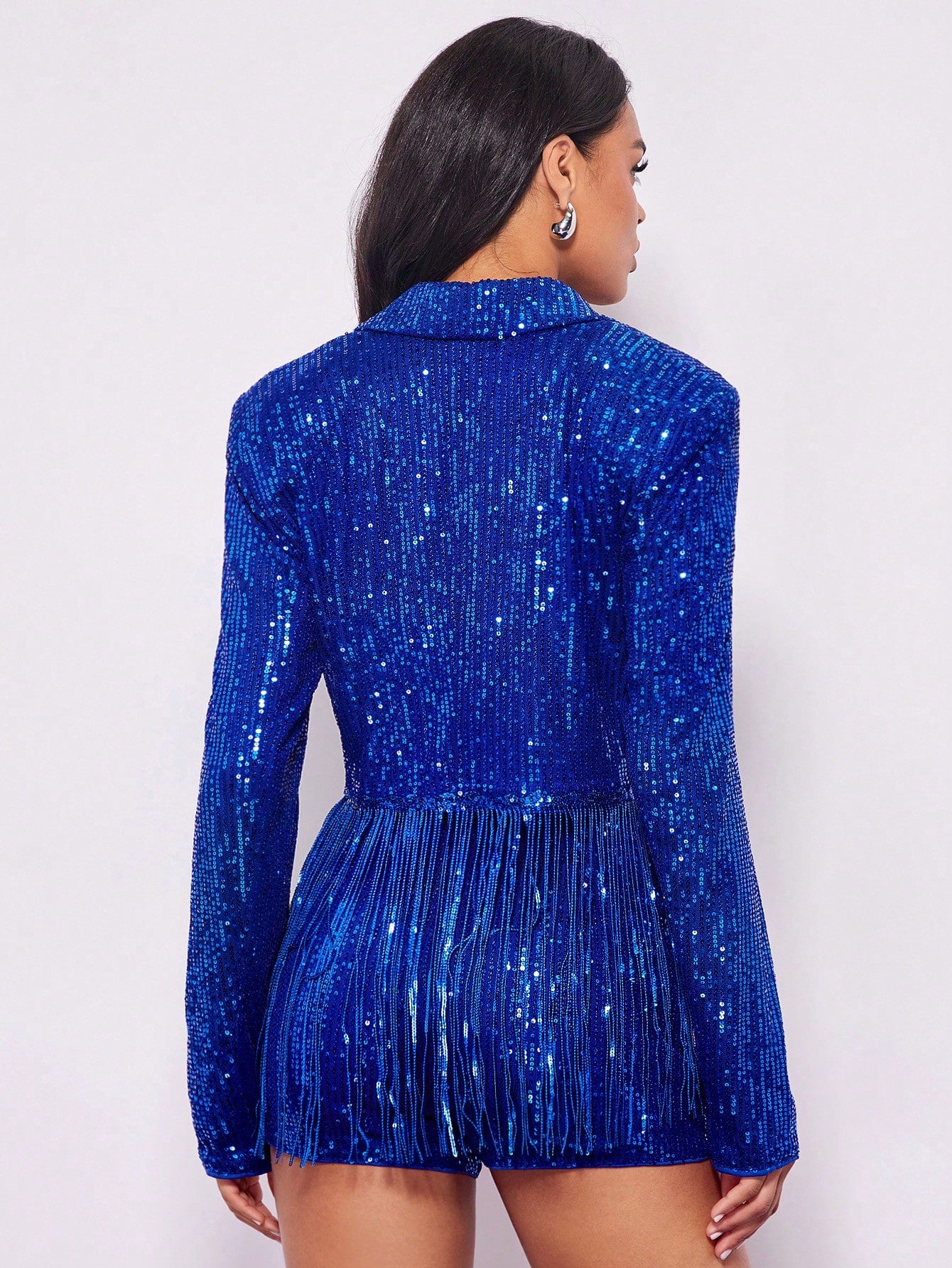 model from behind wearing a Blue sequin jacket fancy dress