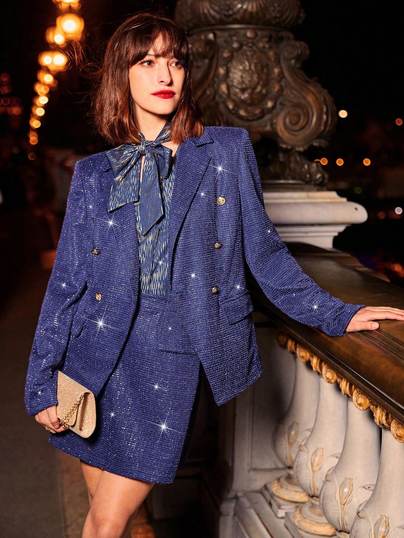 model in paris wearing a Blue glitter jacket