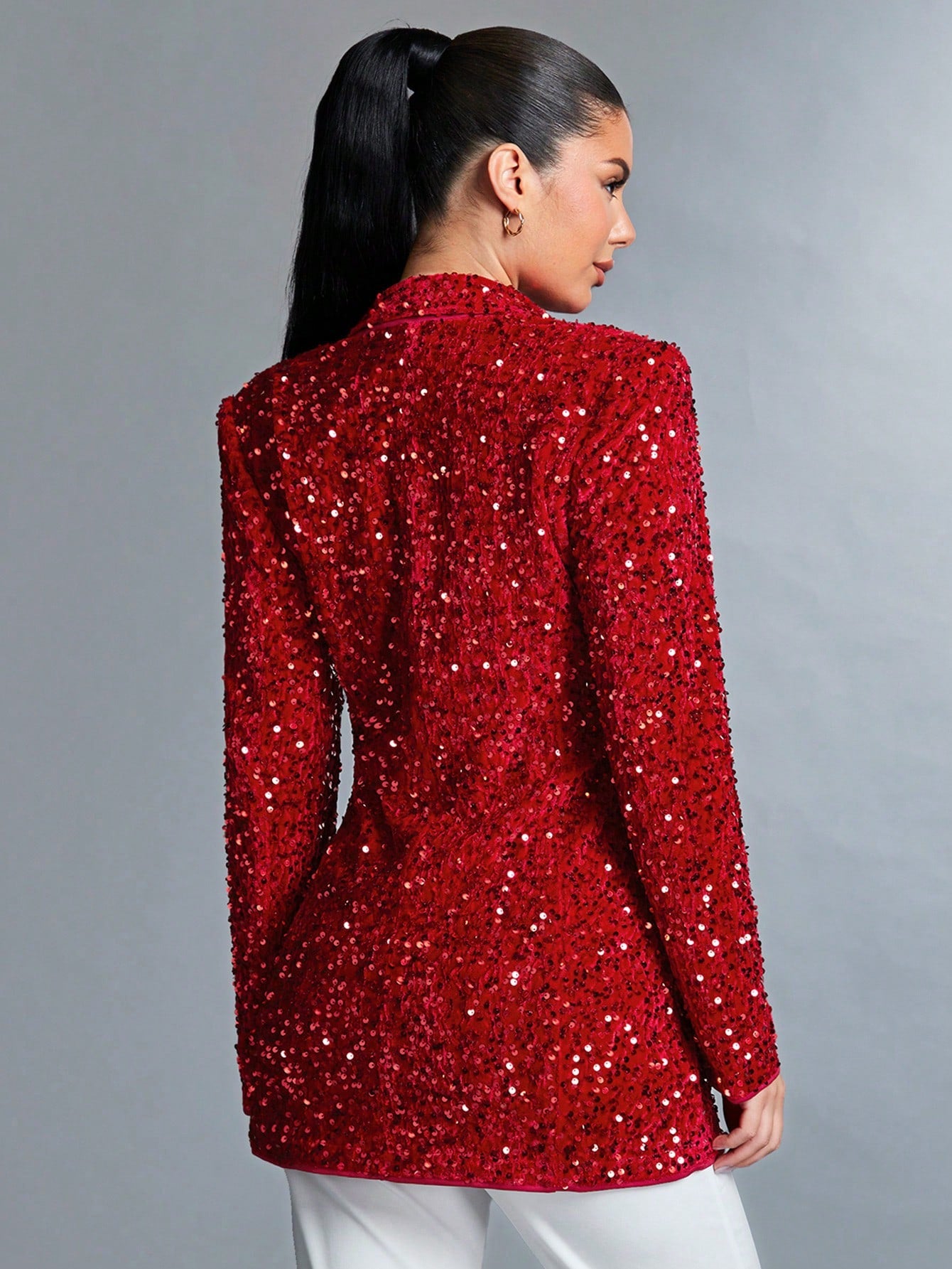 Sparkly red jacket from behind, worn by a model for product picture