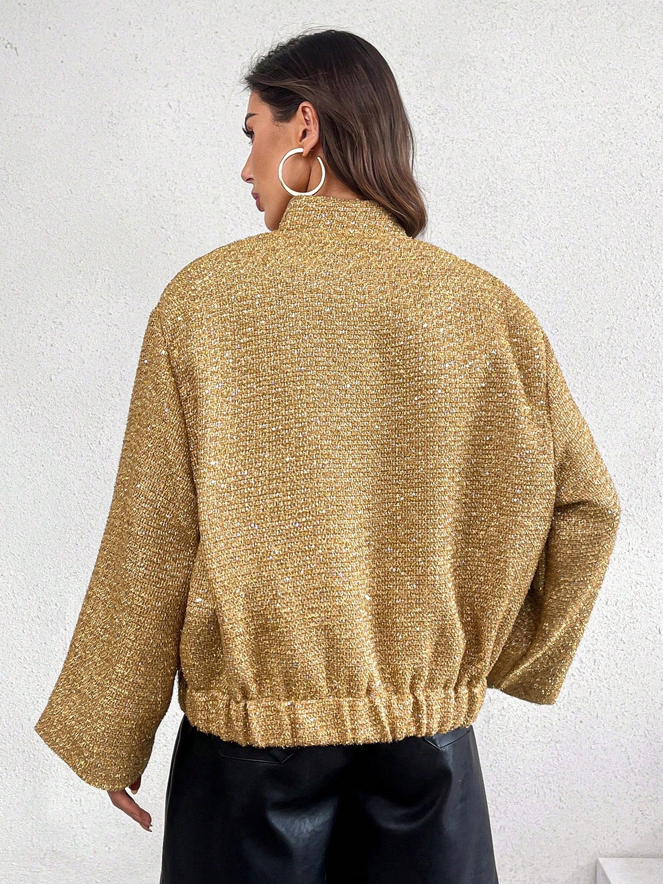 Gold sequin sleeve jacket from behind, white background