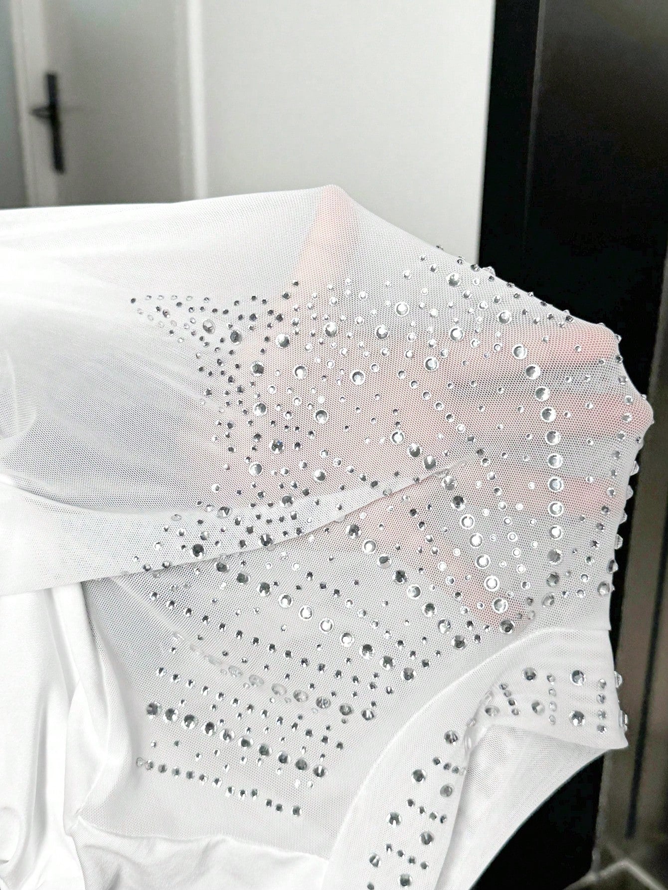 white sequins placed on a white White bodysuit long sleeve