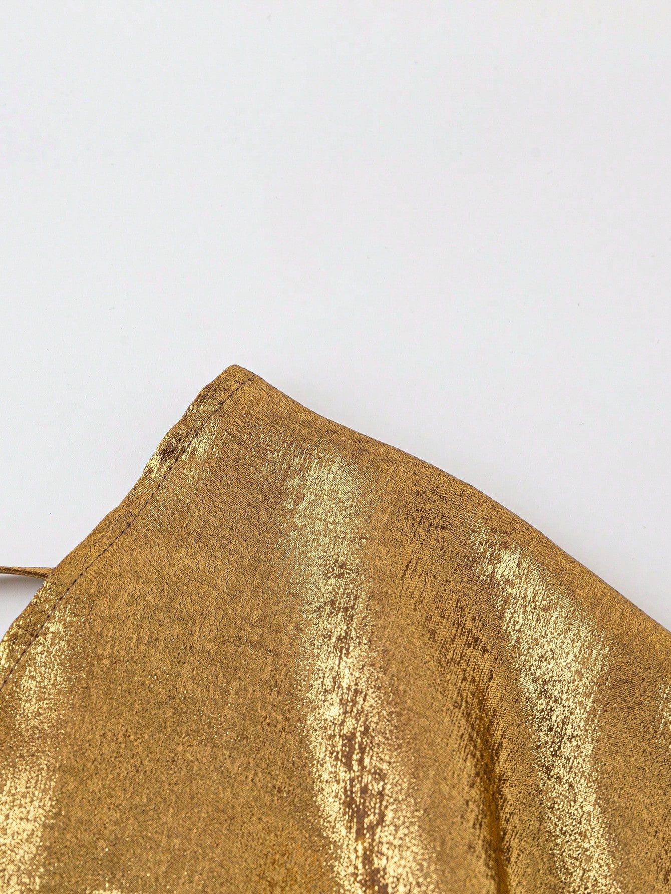 zoom on the gold fabric of our Plus size gold sequin bodysuit