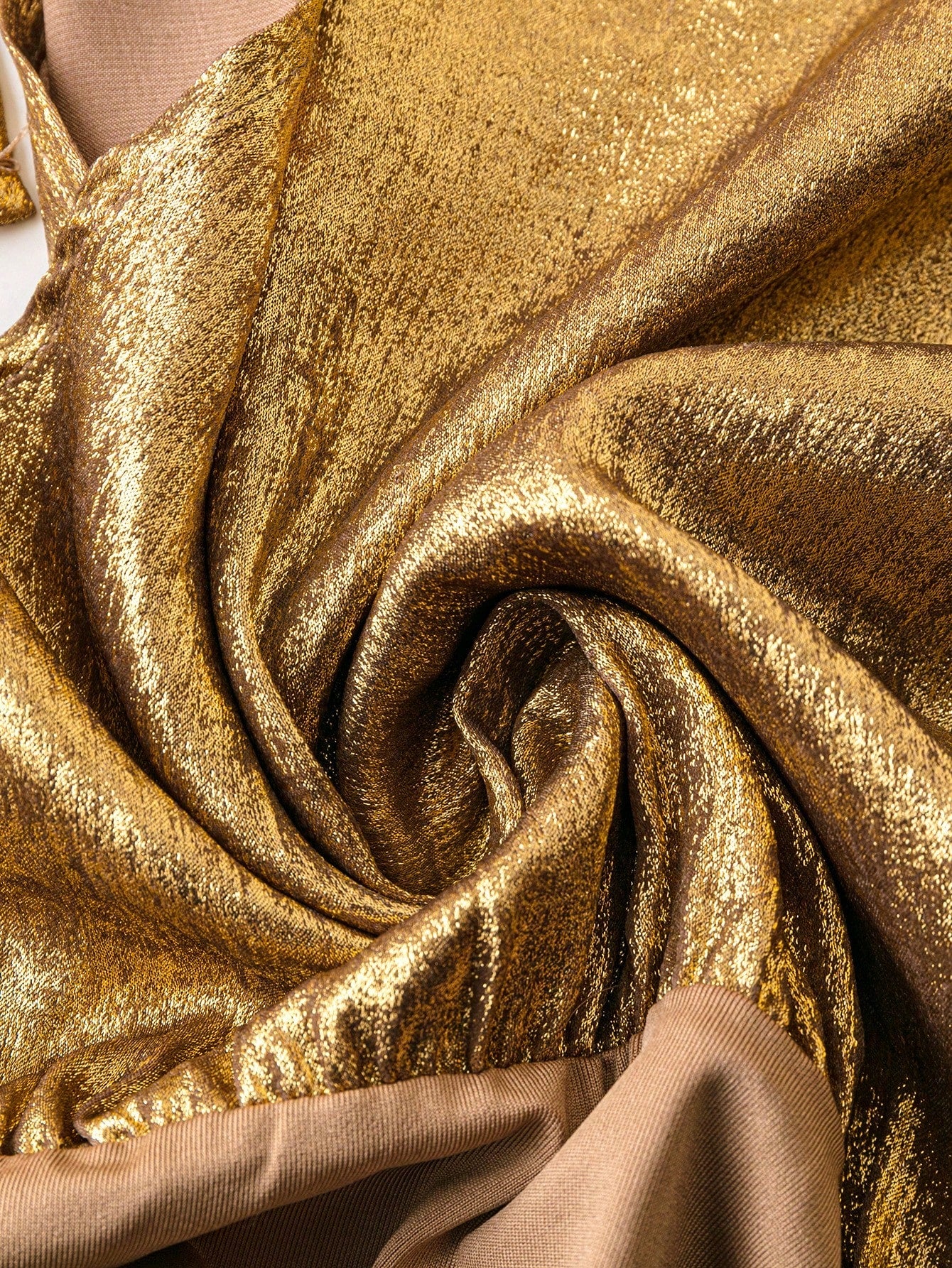 texture of the sequin and the fabric of a Plus size gold sequin bodysuit