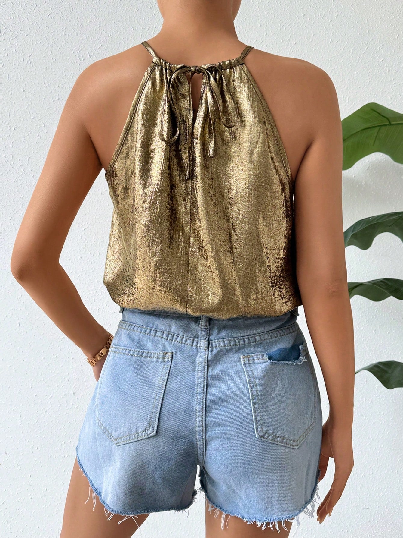 Black and gold sequin bodysuit view from behind