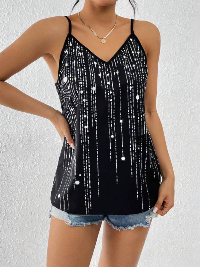 Black and silver sequin tank top paired with a jeans short