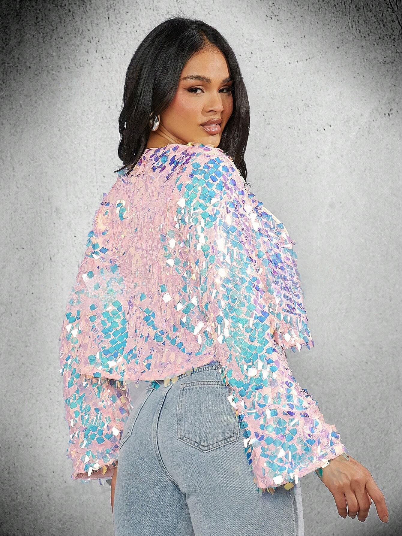 Pink and blue sequin jacket from behind worn by a black model